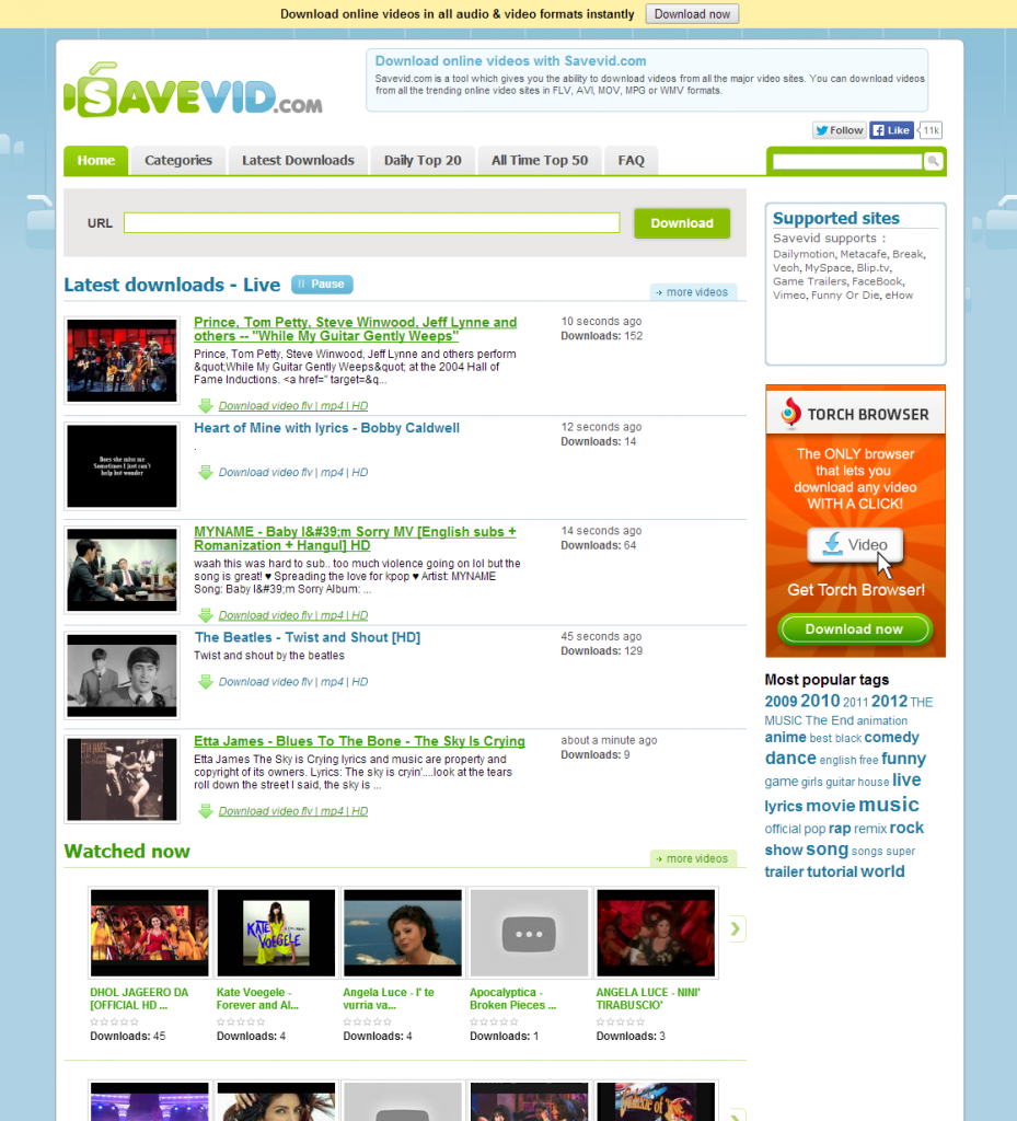 savevid.com download online video and audio - initial screen full of ads and community